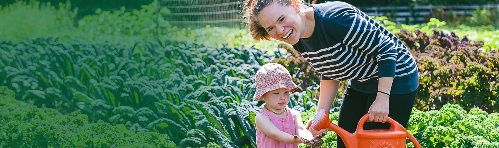 [Inspiring Hope, Caring for Creation] A Rocha intern gardening with a young child