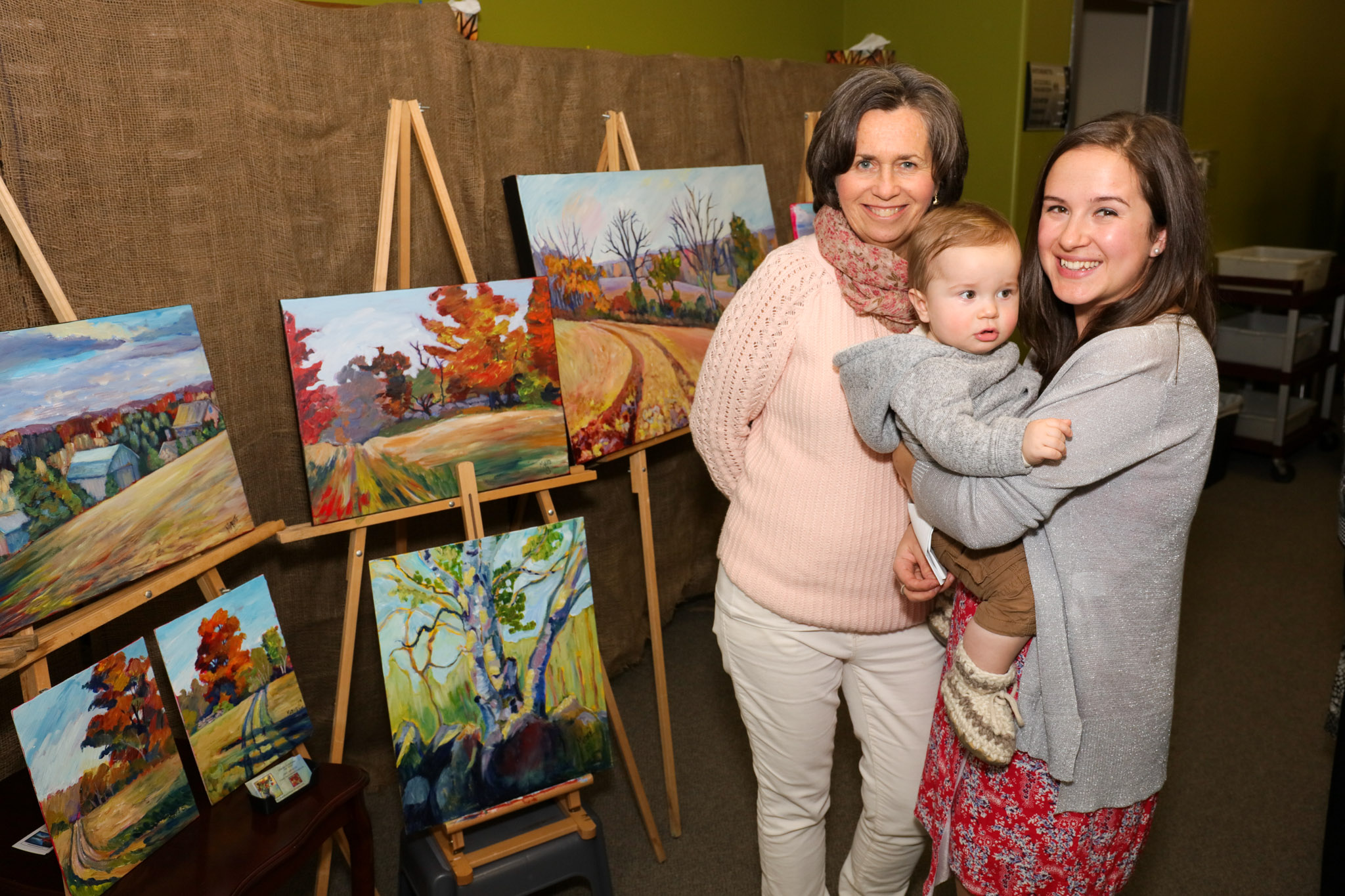 Posing with Paintings at Stories and Song Hamilton