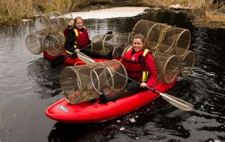 Melanie and Elise in Kayaks with Nets