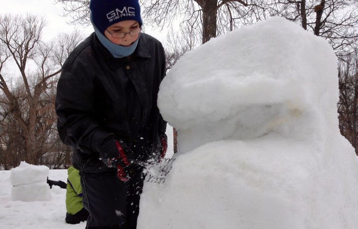 Child Perfects Snowman