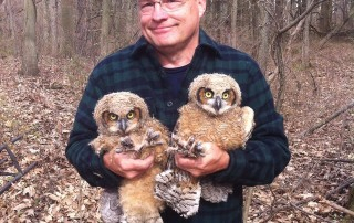 Ontario Volunteer holding Owls