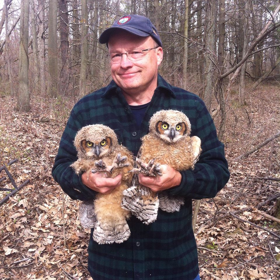Ontario Volunteer holding Owls