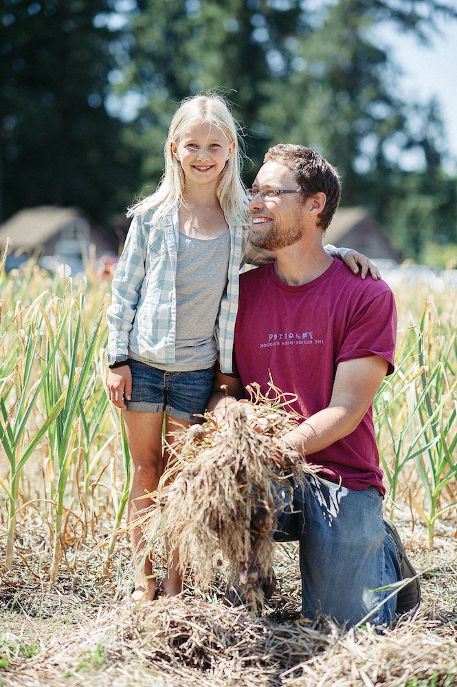 Farmer Paul Poses with his Daughter