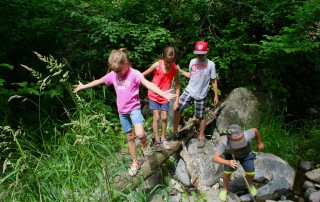 Kids Balance on Rocks in Manitoba