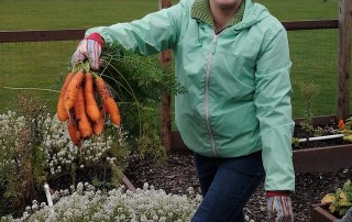 Esther Cannon harvesting carrots Christ Covenant Church Community Garden, Langley 2016