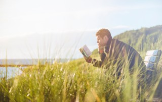 Man sitting and reading book