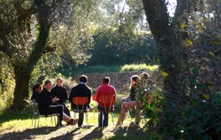 People sitting in a group outside