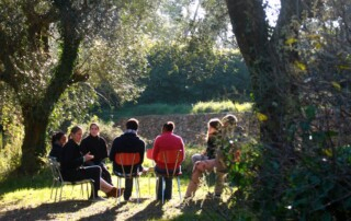 People sitting in a group outside