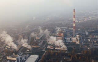 Aerial view of factories and their smoke emissions